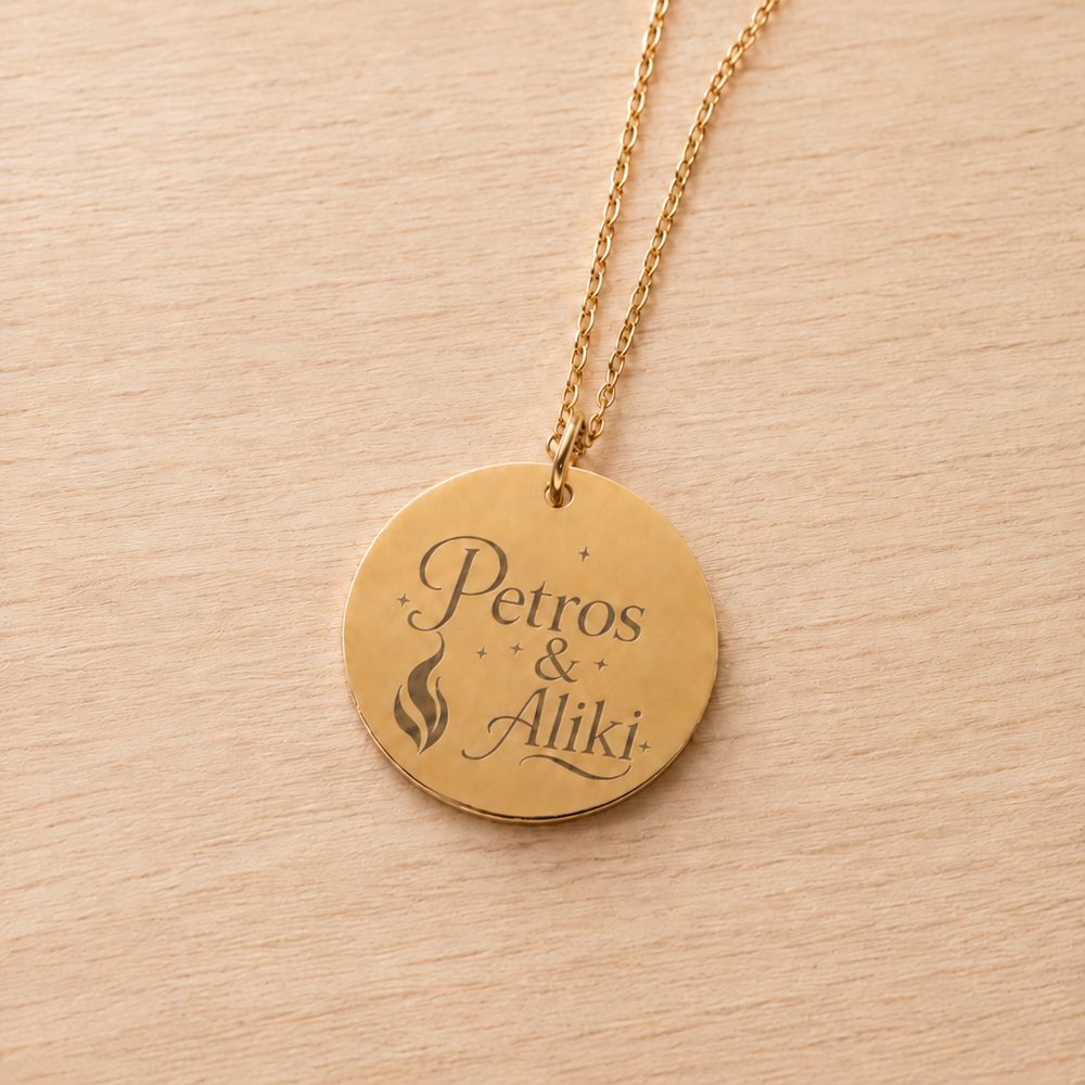Gold pendant on a fine chain, engraved with two first names
